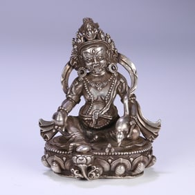 A beautiful statue of the Silver Buddha in sterling silver and yellow God of Wealth