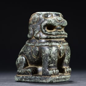 A beautiful small stone lion on the desk