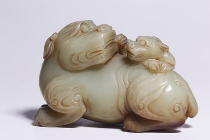 A piece of Qing Dynasty Hetian white jade mother beast handle