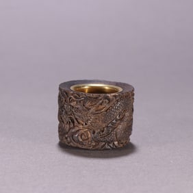 A Qing Dynasty agarwood bag with a golden dragon pattern finger