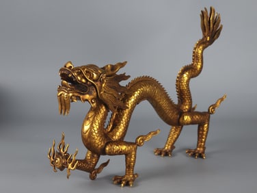 A copper-gilt dragon ornament