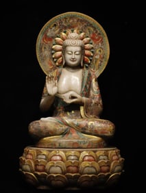 A white jade painted Buddha statue from the Tang Dynasty