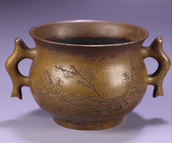 A Ming Dynasty Xuande double fish ear copper incense burner