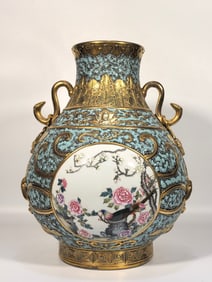 A Qing Qianlong enamel bronze glaze gilded window flower and bird ruyi ear vase
