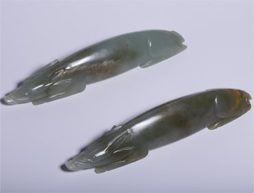 A pair of Hetian jade pig ornaments from the Ming Dynasty