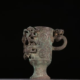 A sterling silver dragon pattern cup from the Qing Dynasty