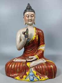 A beautiful seated porcelain Buddha