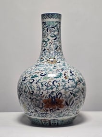 A Doucai entwined lotus pattern heavenly ball vase made in the Qianlong period of the Qing Dynasty