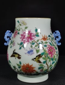 A Qing Yongzheng enamel flower statue