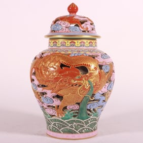 A Qing Dynasty Qianlong enamel colorful fish leaping dragon gate hollow tea jar