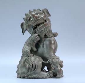 A Qing Dynasty bronze lion ornament