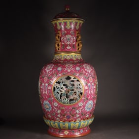 A Qing Dynasty Qianlong pastel carmine flower hollow floral pattern turning vase