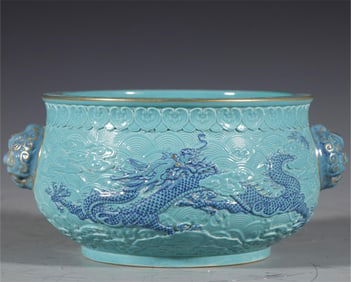 A carved turquoise green glazed dragon made in the Qianlong period of the Qing Dynasty was washed