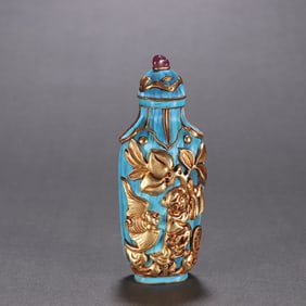 A silver-gilded emerald boy of the Qing Dynasty snuff bottle