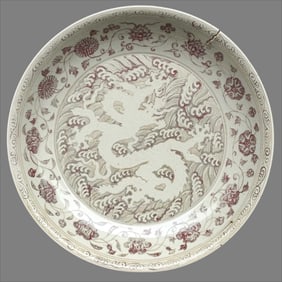 A glazed red entwined flower from the Xuande period of the Ming Dynasty is secretly engraved with