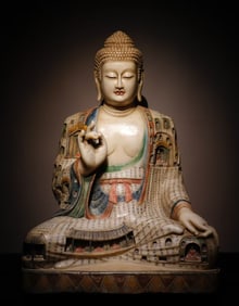 A white jade painted Buddha from the Tang Dynasty