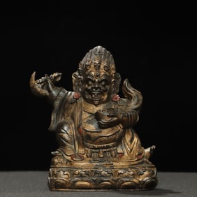A statue of the Vajra hand in copper clay and gold
