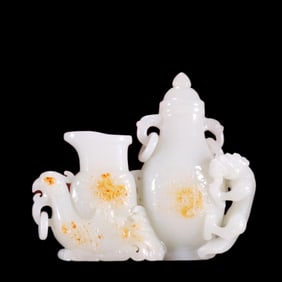 A Qing Dynasty Hetian jade seed material carved dragon and phoenix bottle