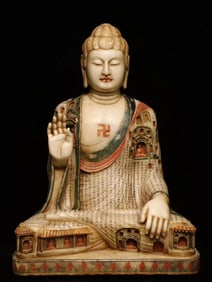 A white jade painted Buddha from the Tang and Han dynasties