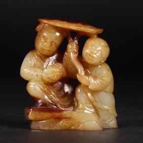 A carving of Hetian jade and a boy