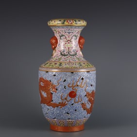 A Qing Dynasty Qianlong era enamel color hollow carved gold-painted double dragon bead beast ear
