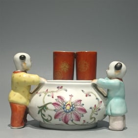 A pastel boy bolster entwined with flower pattern brush wash made in the Qianlong period of the Qing