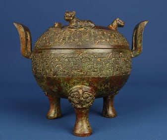 A Han Dynasty bronze crouching tiger tripod