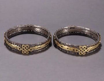 A pair of silver-gilt auspicious bracelets from the Qing Dynasty