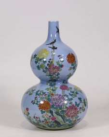 A Qing Dynasty Qianlong sky blue glaze pastel flower and bird poetry gourd bottle