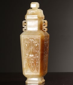 A Qing Dynasty Hetian white jade whole carved animal face pattern appreciation bottle