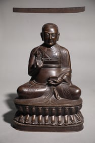 A seated statue of a Buddha in a bronze tire in the Qing Dynasty