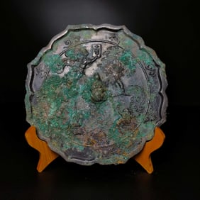 A bronze black lacquer ancient figure mirror