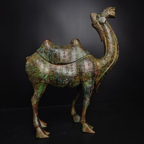 A Warring States bronze inscription camel statue