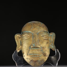 A fine copper-gilt mask