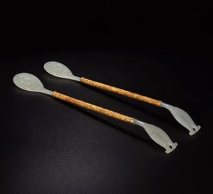 A pair of Qing Dynasty court style gold-plated jade spoons
