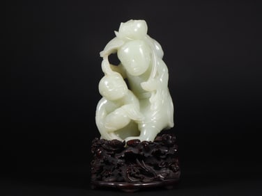 A Qing Dynasty Hetian jade carving and two immortal ornaments
