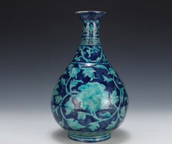 A Ming Dynasty Yongle blue background green jade pot spring vase
