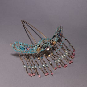 A Qing Dynasty silver-gilt emerald double phoenix morning sun hairpin