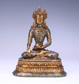 A Qing Dynasty bronze gilt statue of Shakyamuni,