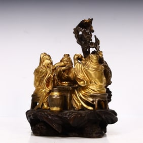 A Qing Dynasty copper gilt peach orchard three-knot ornament