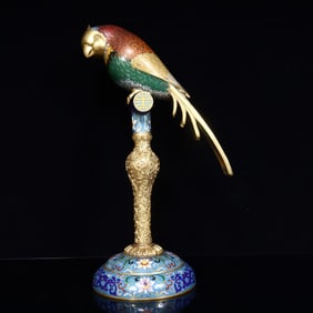 A Qing Dynasty cloisonné parrot ornament