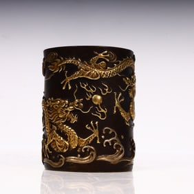 A Qing Dynasty copper double dragon ballpoint pen holder