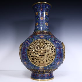 A Qing Dynasty cloisonné windowed dragon pattern bottle