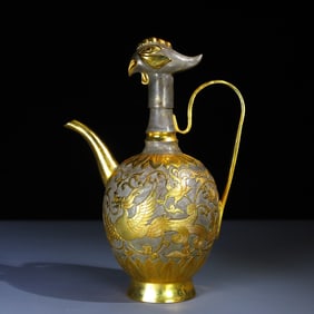 A gilded crested wine jug