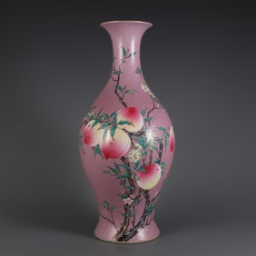 A Qing Yongzheng year carmine powder ground pickled flower pastel eight peach pattern olive bottle