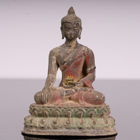 A Tang Dynasty painted bronze Buddha