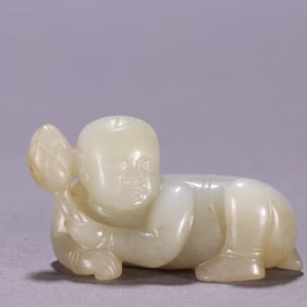A Hetian jade boy holding a lotus carving
