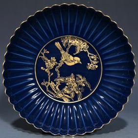 A Yongzheng sacrifice blue gilded flower and bird pattern chrysanthemum petal plate