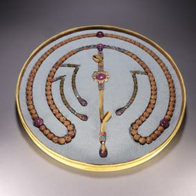 A plate of Qing Dynasty silver-gilt tourmaline morning beads