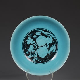 A Ming Xuande ink blue color entwined flower and fruit pattern plate